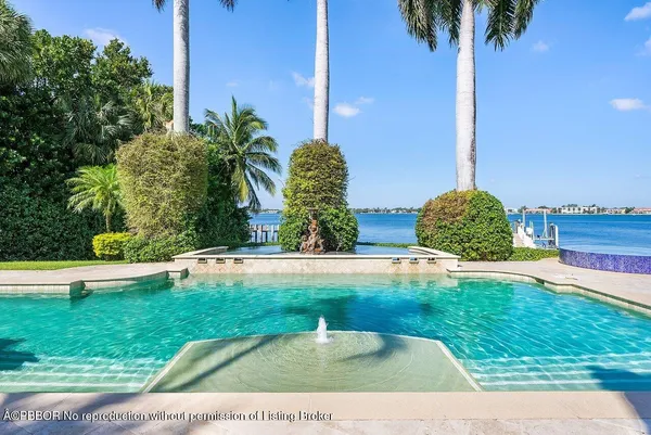 a view of swimming pool with a patio