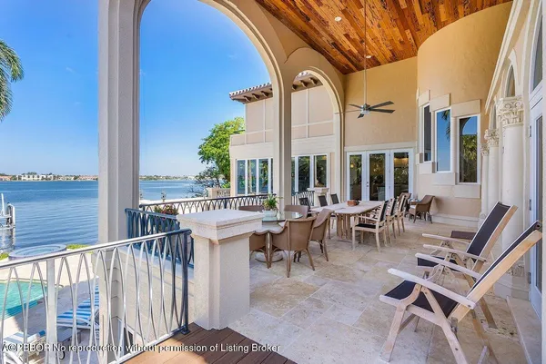 a view of a swimming pool and lounge chairs