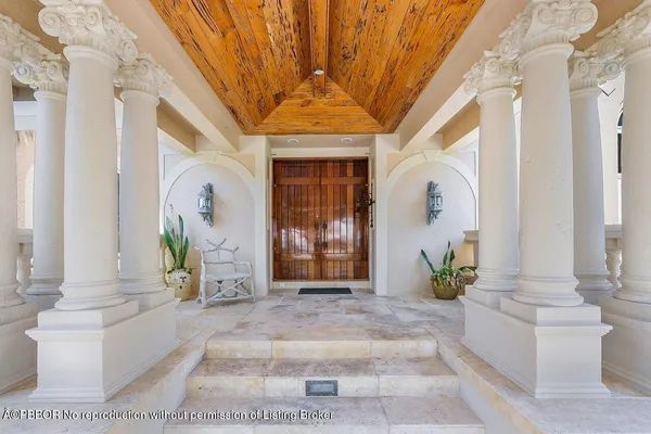 a front view of a house with outdoor seating