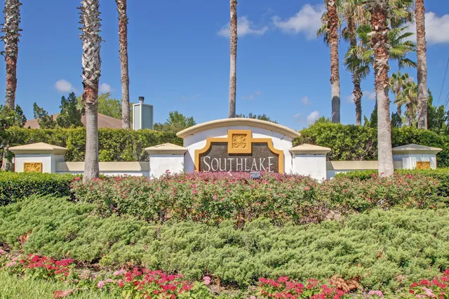 an aerial view of a house with a yard and garden