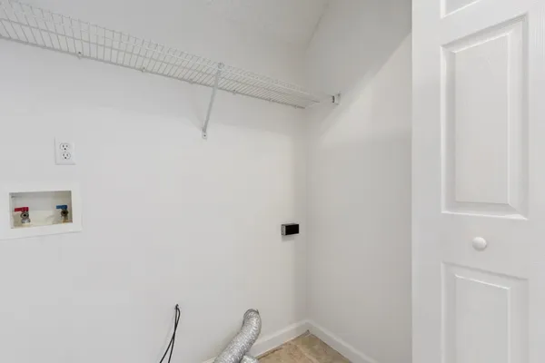 a view of a room with racks on the wall