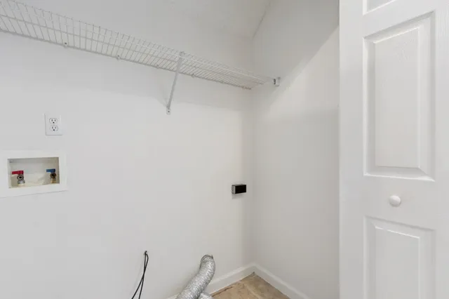 a view of a room with racks on the wall