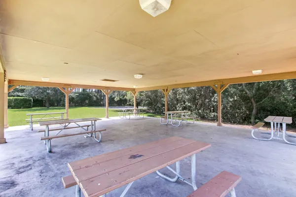 a view of a patio with a yard