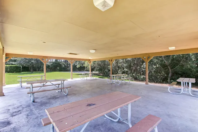 a view of a patio with a yard