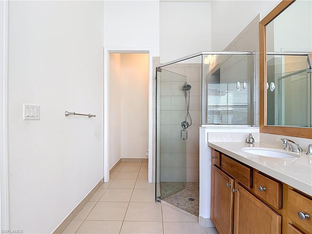 5118 Genoa Street Ave Maria, FL 34142 - Photo 20 of 28 a bathroom with a sink and a mirror