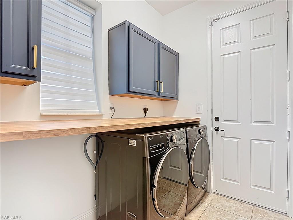 5118 Genoa Street Ave Maria, FL 34142 - Photo 26 of 28 a utility room with a sink a washer and dryer