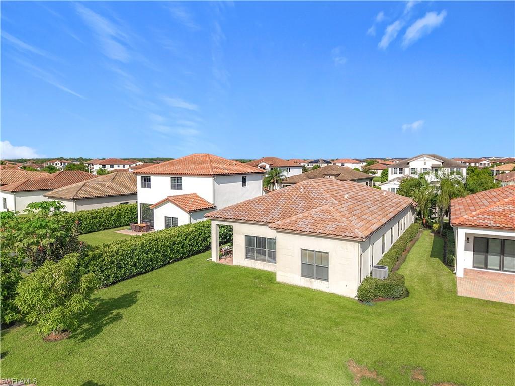 5118 Genoa Street Ave Maria, FL 34142 - Photo 28 of 28 a front view of a house with a yard