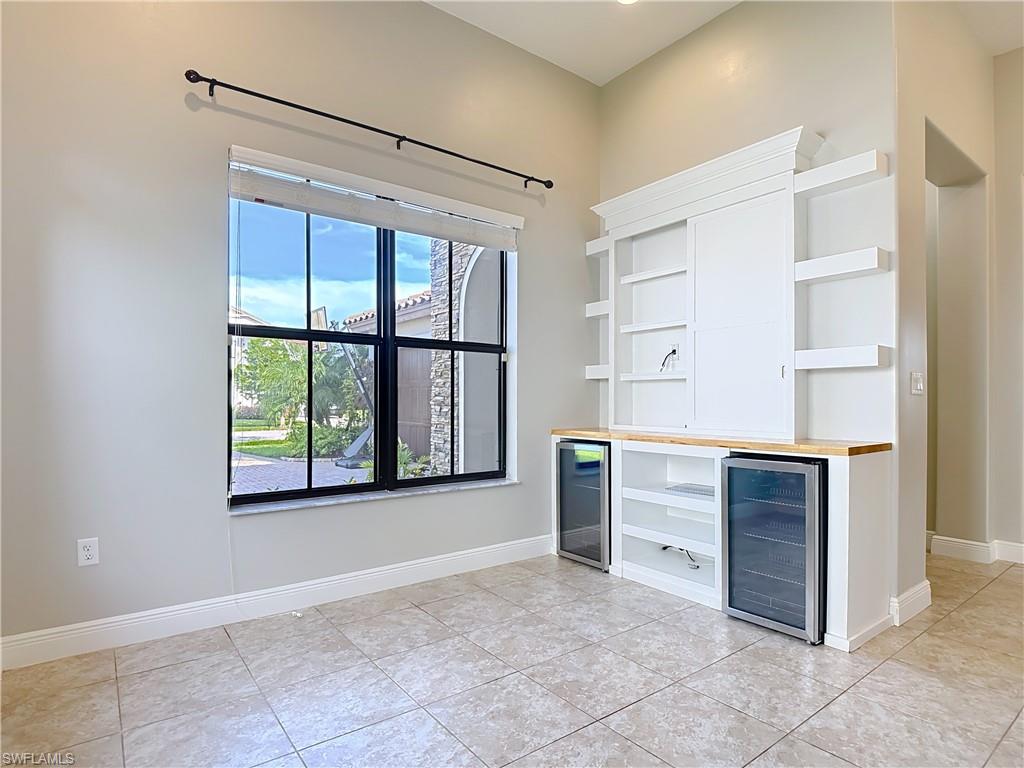 5118 Genoa Street Ave Maria, FL 34142 - Photo 6 of 28 a view of a kitchen with furniture and windows