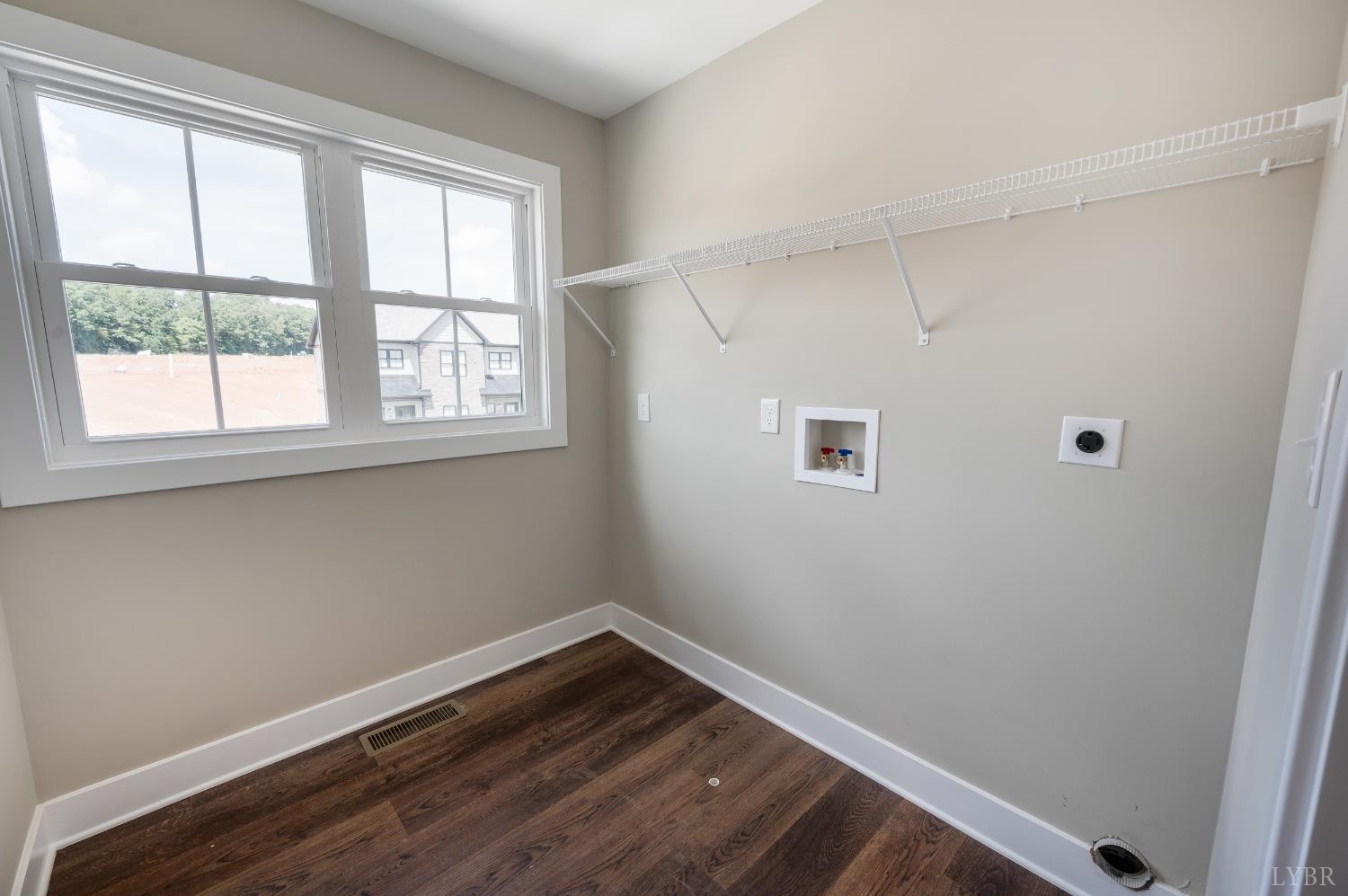 83 Luke Court Rustburg, VA 24588 - Photo 32 of 38 a view of an empty room with wooden floor and a window