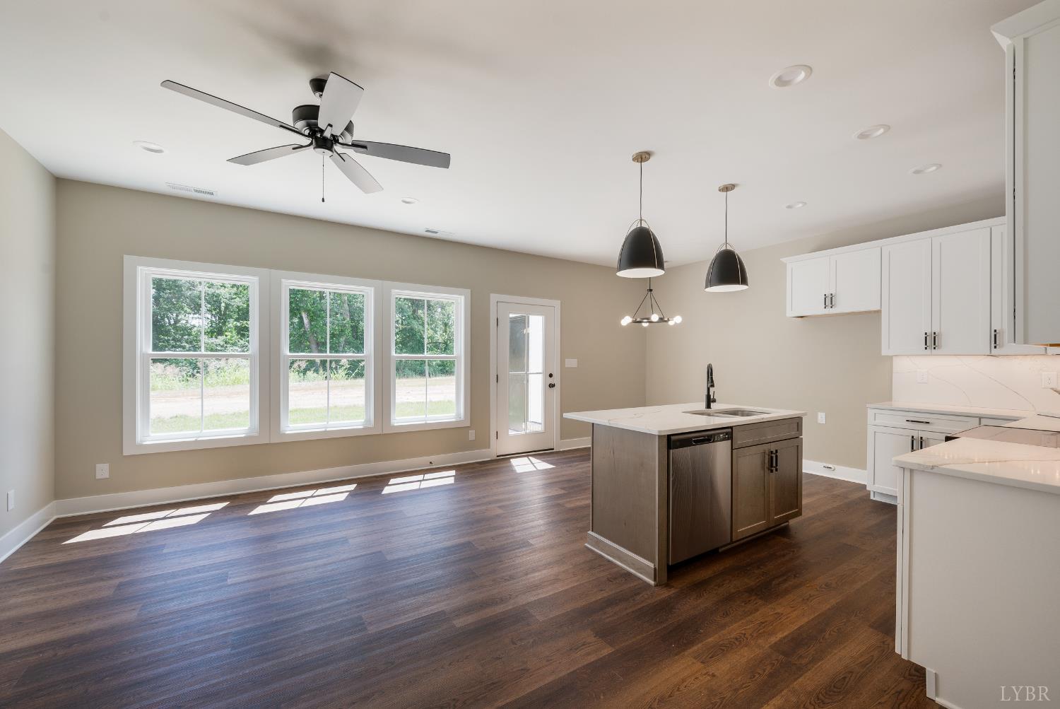83 Luke Court Rustburg, VA 24588 - Photo 7 of 38 a kitchen with stove and wooden floor