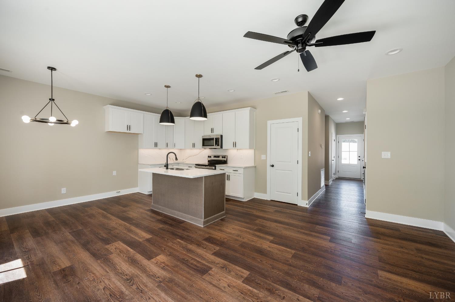 83 Luke Court Rustburg, VA 24588 - Photo 8 of 38 a view of a kitchen with a sink and wooden floor