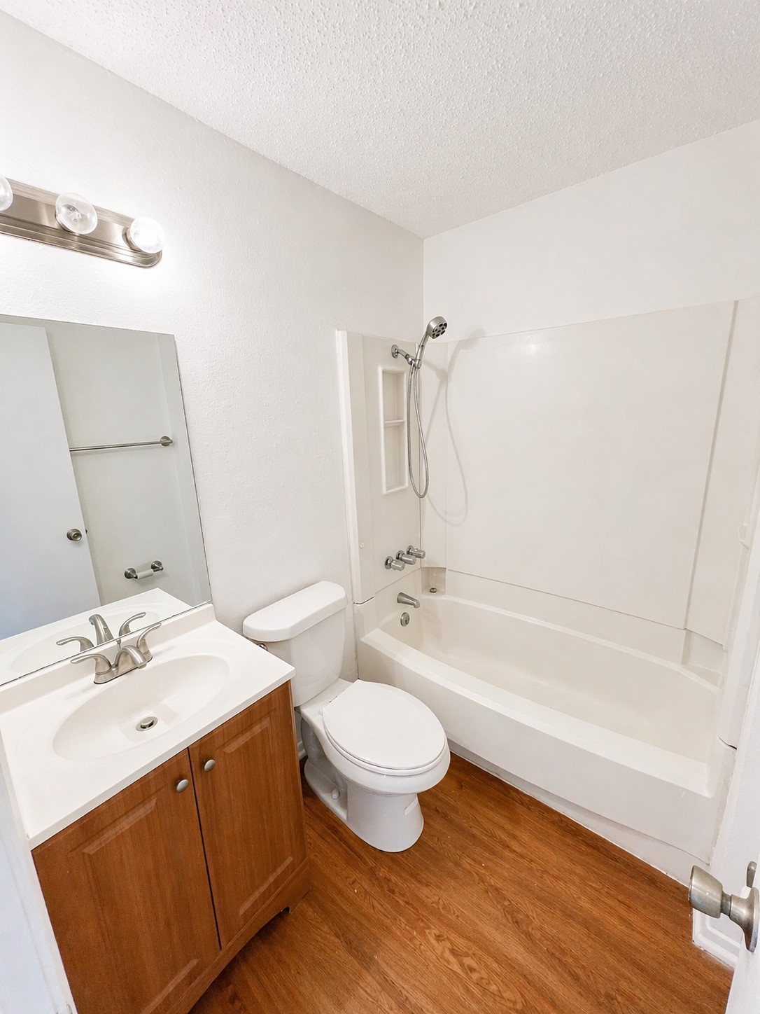 2307 Rachael Court, Unit D Austin, TX 78748 - Photo 6 of 7 a bathroom with a sink a toilet and a bathtub