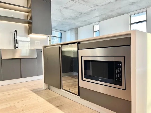 a kitchen with a sink and a stove