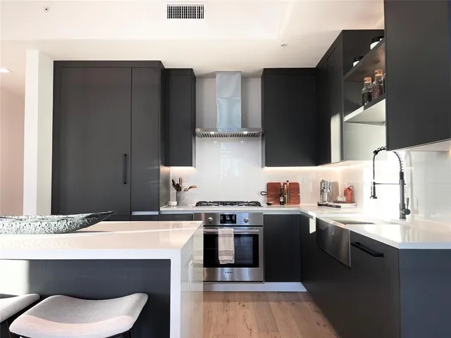 a kitchen with a sink and cabinets