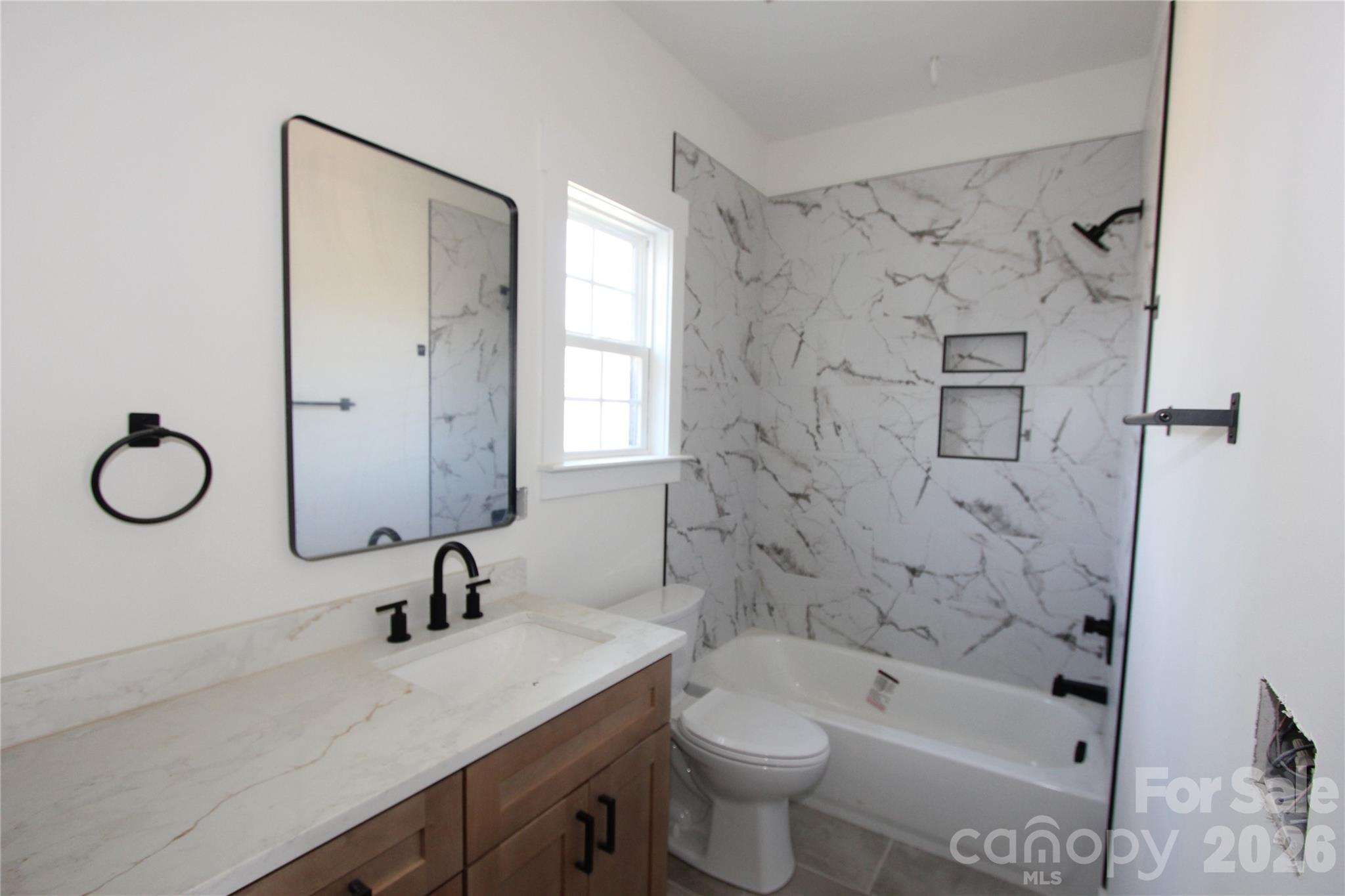 155 Rudisill Road Lincolnton, NC 28092 - Photo 13 of 15 a bathroom with a granite countertop sink a toilet and bathtub