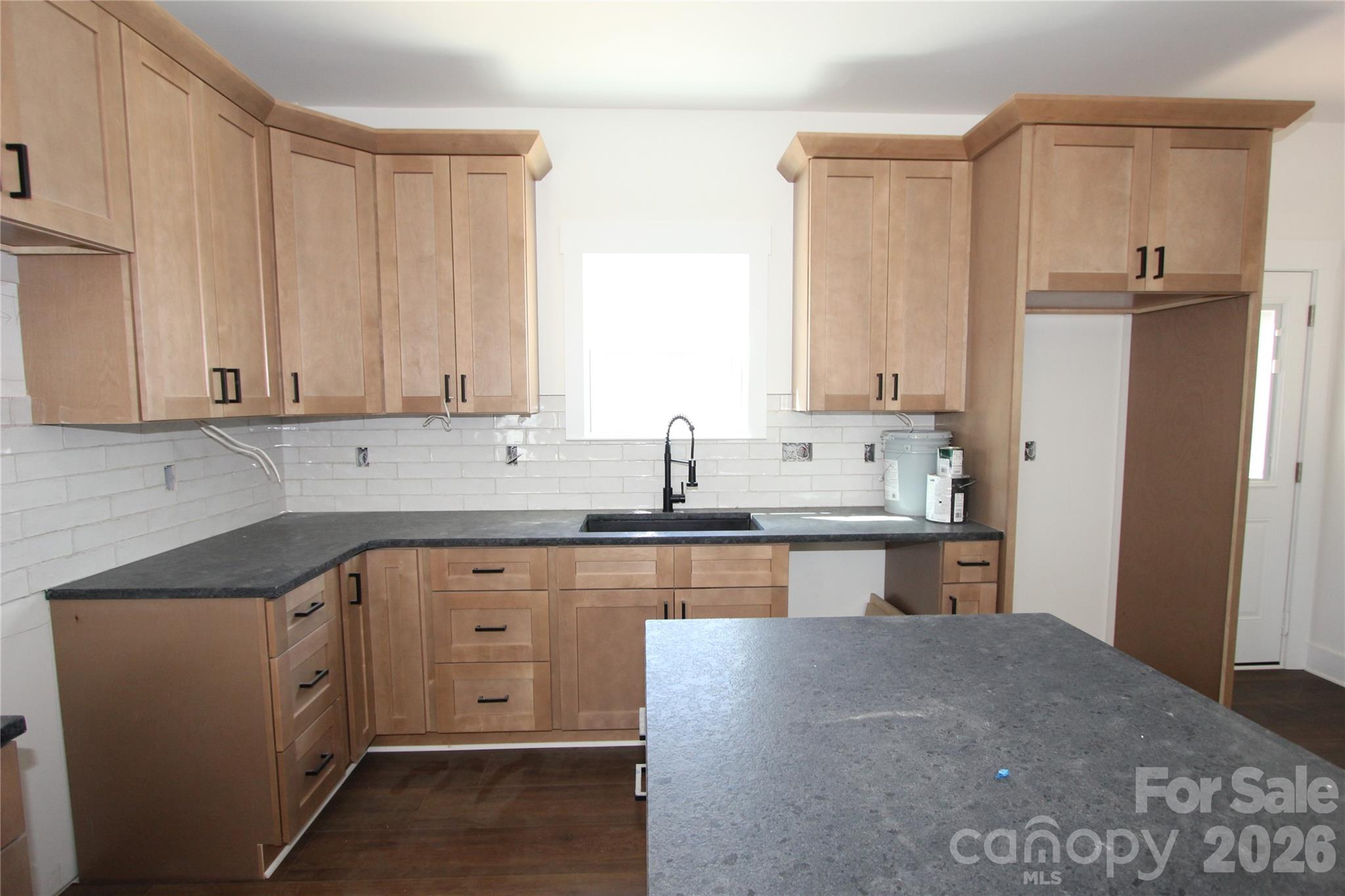155 Rudisill Road Lincolnton, NC 28092 - Photo 2 of 15 a kitchen with stainless steel appliances granite countertop a refrigerator and cabinets