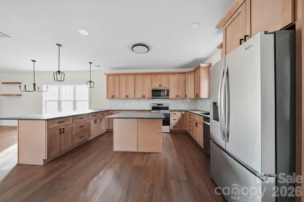 a view of a small space with wooden floor