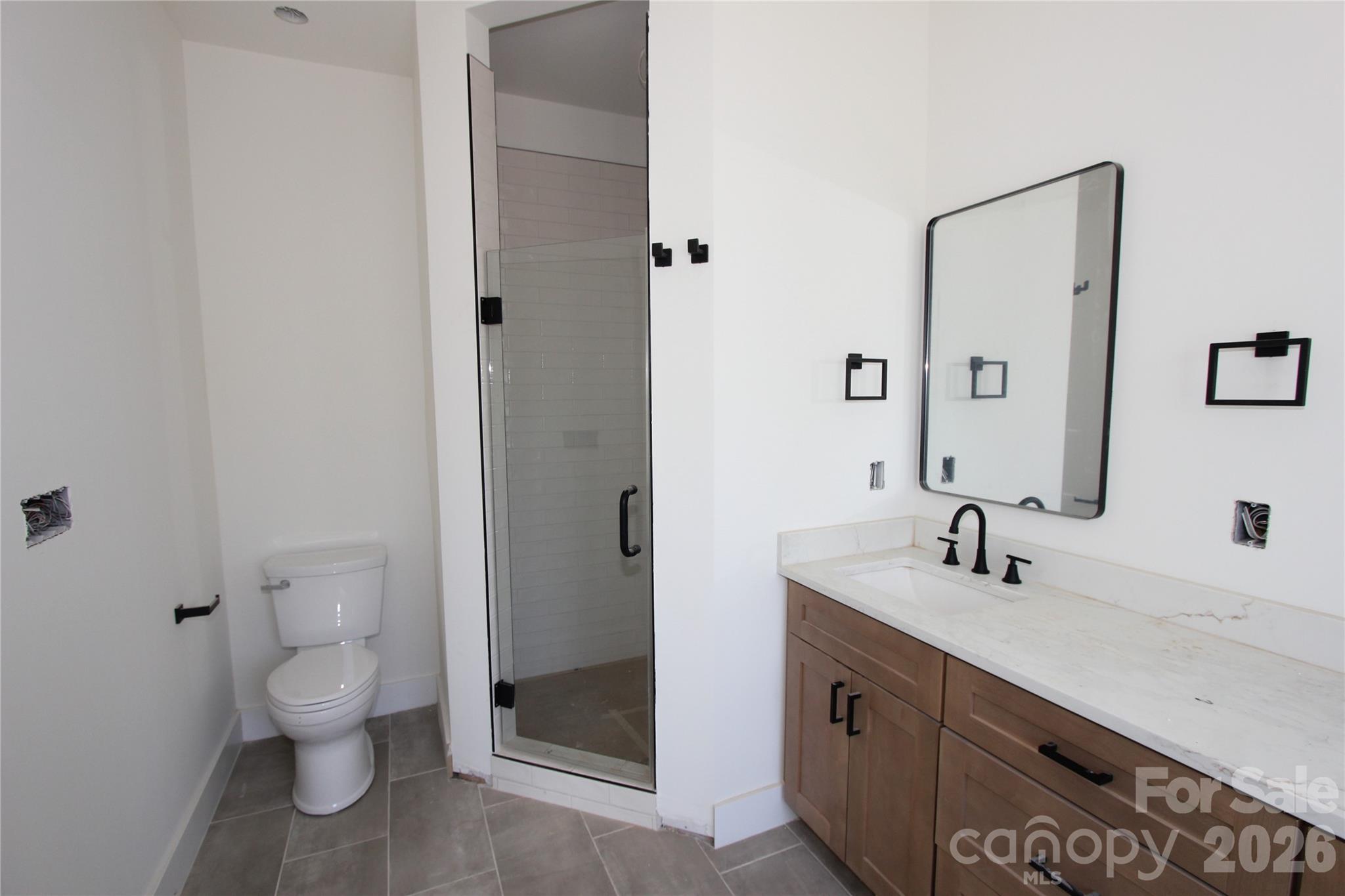 155 Rudisill Road Lincolnton, NC 28092 - Photo 10 of 15 a bathroom with a double vanity sink toilet and shower