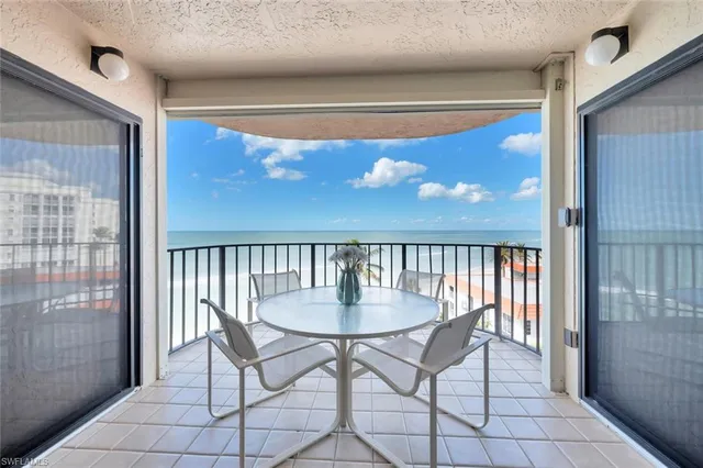 a view of a dining room with furniture and window