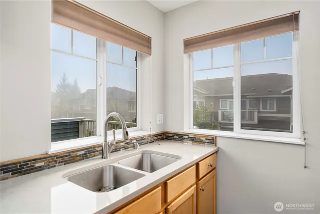 a view of a sink and a window