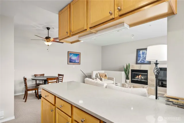 a living room with furniture and fireplace