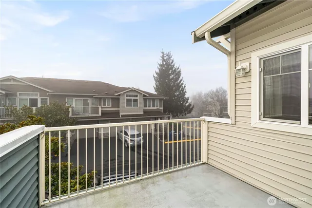 a view of a houses with a small deck