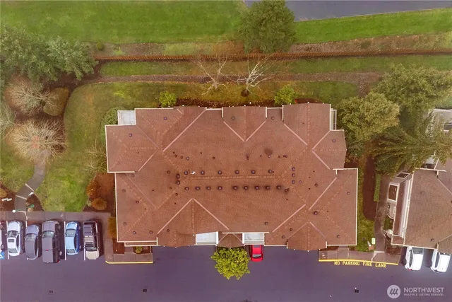 an aerial view of a house with a ocean view