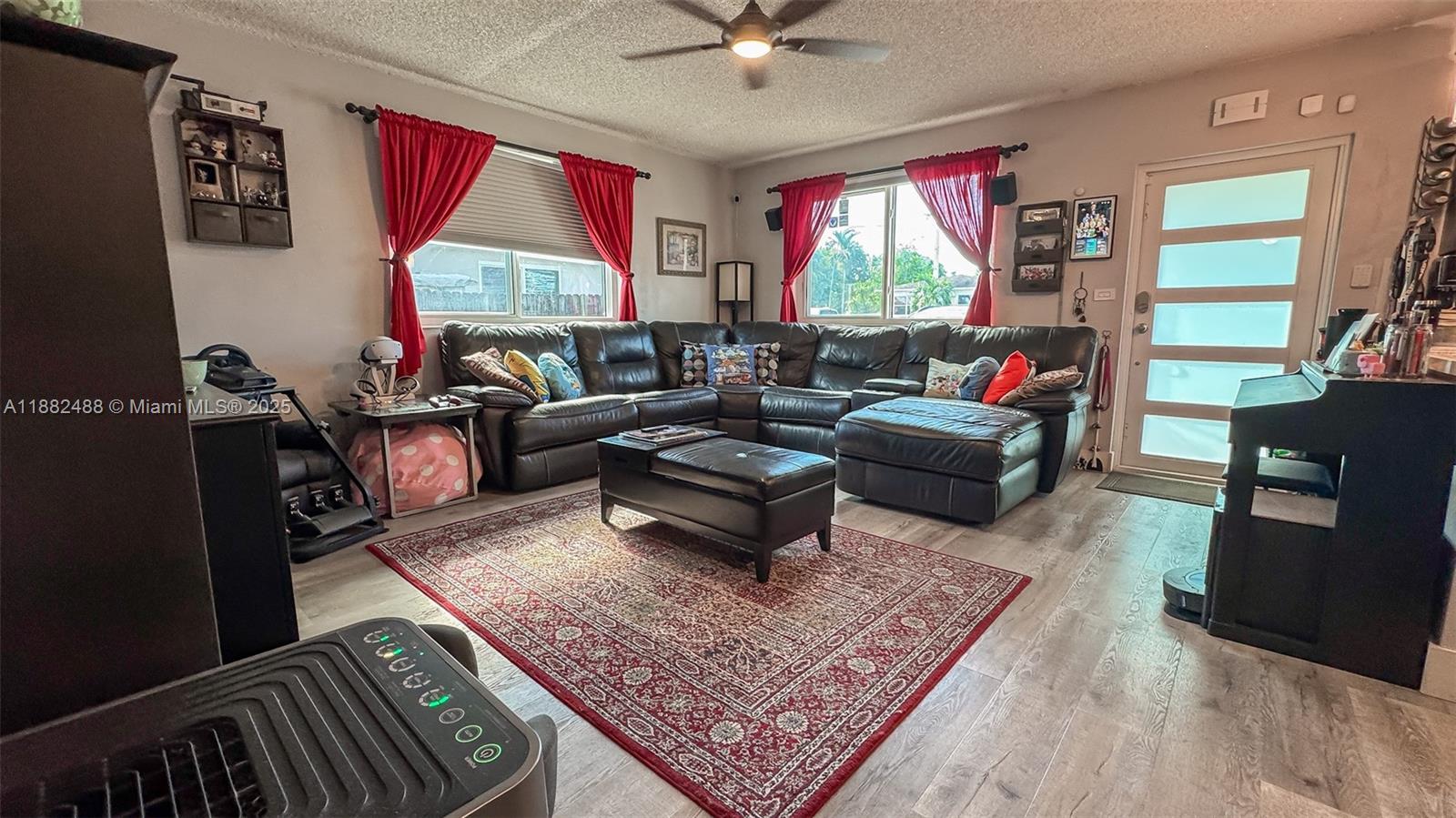 683 Southeast 6th Place Hialeah, FL 33010 - Photo 17 of 18 a living room with furniture rug and window