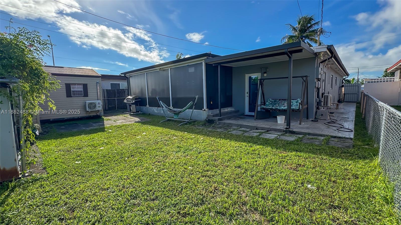 683 Southeast 6th Place Hialeah, FL 33010 - Photo 6 of 18 a view of a house with backyard stove and sitting area