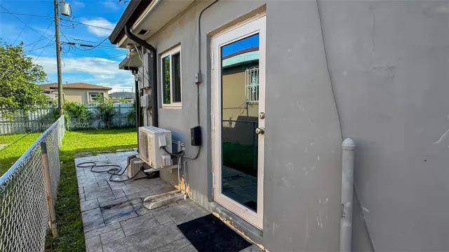 a view of a chair and tables in the balcony