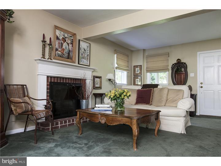 8422 Chippewa Road Philadelphia, PA 19128 - Photo 3 of 25 a living room with furniture and a fireplace