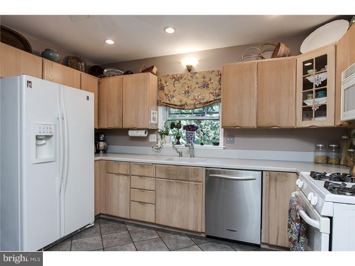 8422 Chippewa Road Philadelphia, PA 19128 - Photo 9 of 25 a kitchen with a sink a refrigerator and cabinets