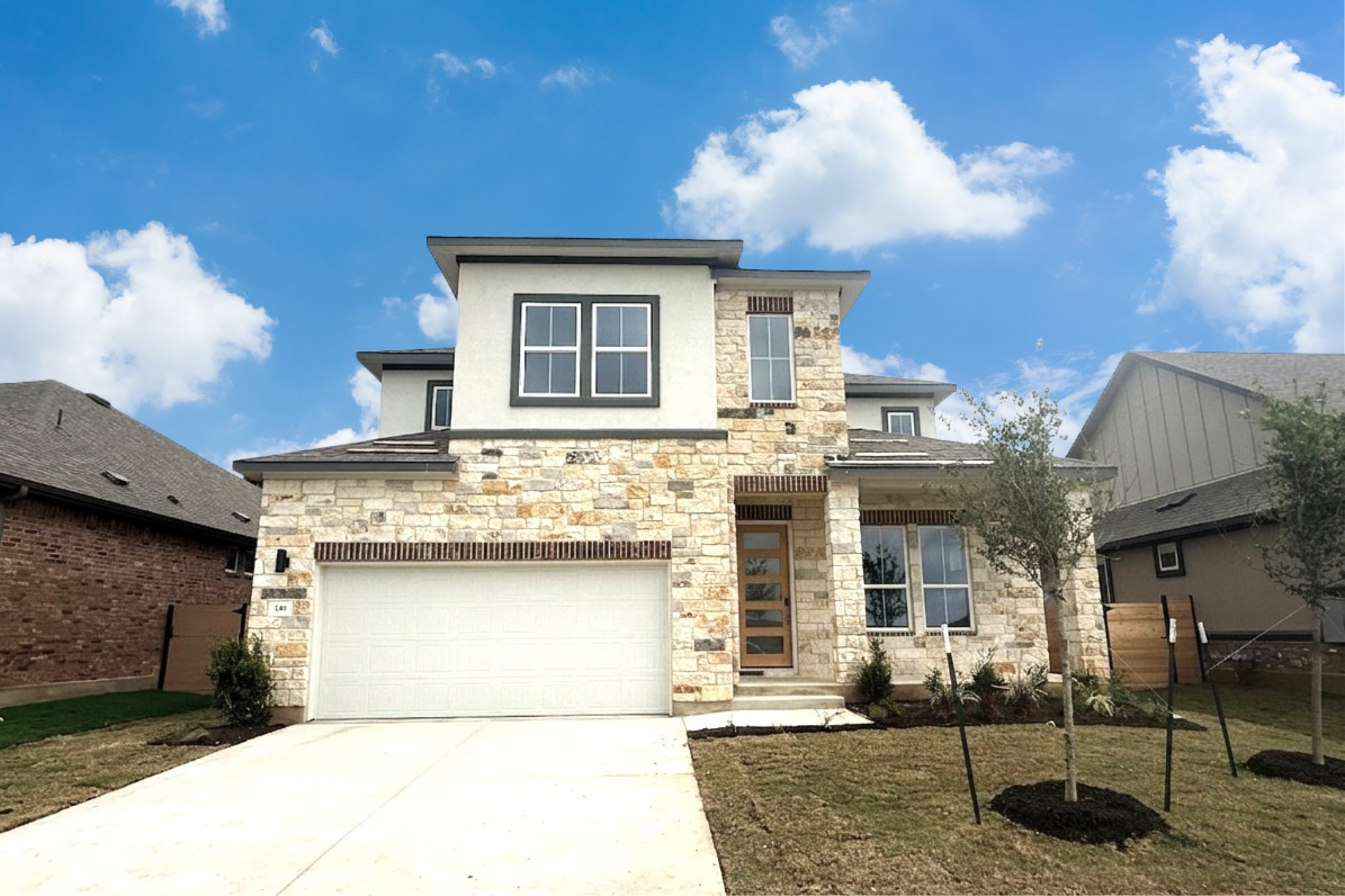 116 Sandrock Trail Georgetown, TX 78633 - Photo 1 of 1 Contemporary two-story residence featuring a stone and stucco facade