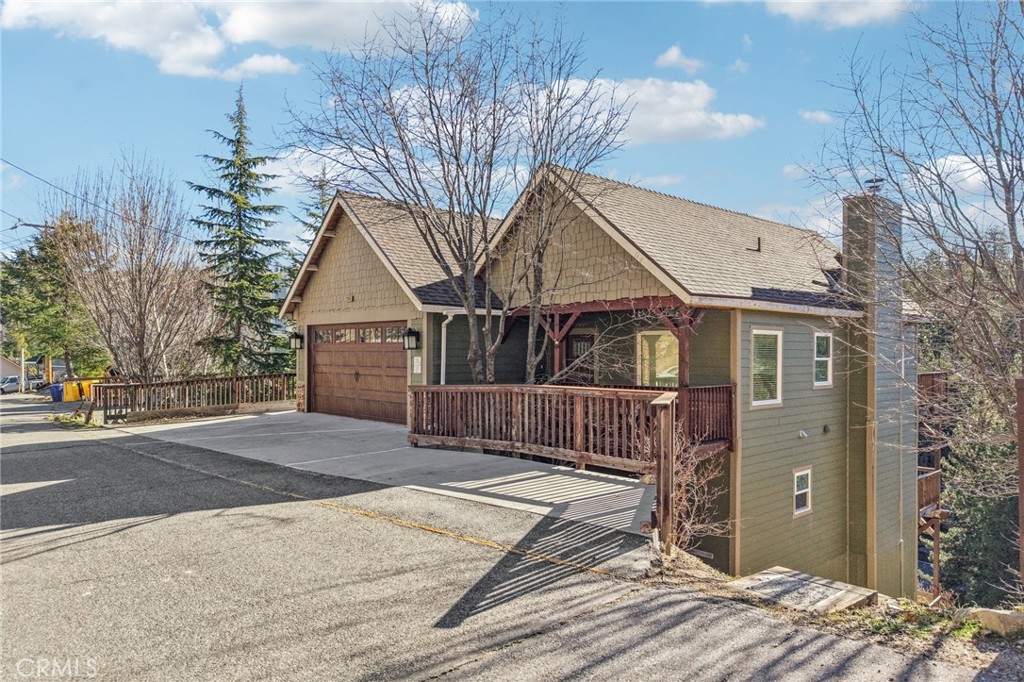 a view of a house with a yard and garage