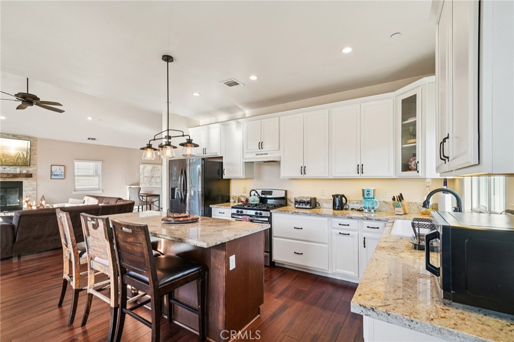 26845 Modoc Lane Lake Arrowhead, CA 92352 - Photo 16 of 56 a kitchen with a sink stove and cabinets