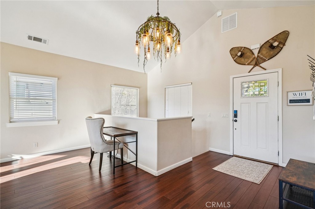 26845 Modoc Lane Lake Arrowhead, CA 92352 - Photo 20 of 56 a view of a dining room with furniture and wooden floor