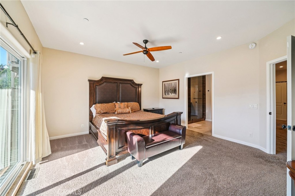 26845 Modoc Lane Lake Arrowhead, CA 92352 - Photo 27 of 56 a living room with furniture a ceiling fan and a rug