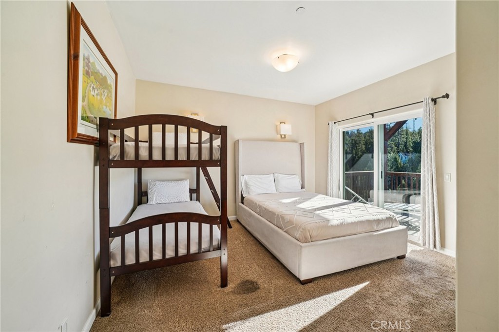 26845 Modoc Lane Lake Arrowhead, CA 92352 - Photo 34 of 56 a bedroom with a bed a window and a potted plant