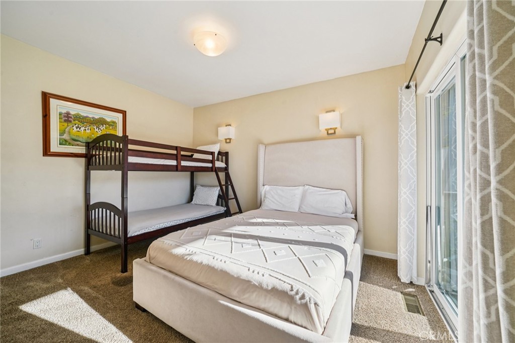 26845 Modoc Lane Lake Arrowhead, CA 92352 - Photo 35 of 56 a bedroom with a bed and a table