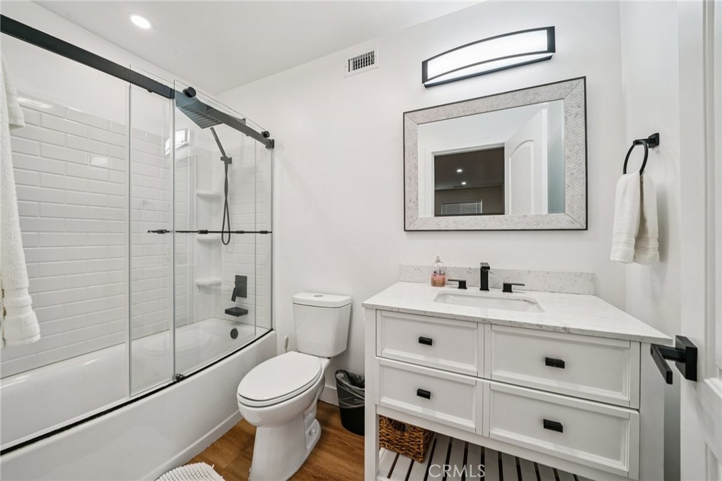 26845 Modoc Lane Lake Arrowhead, CA 92352 - Photo 42 of 56 a bathroom with a toilet sink vanity granite and shower