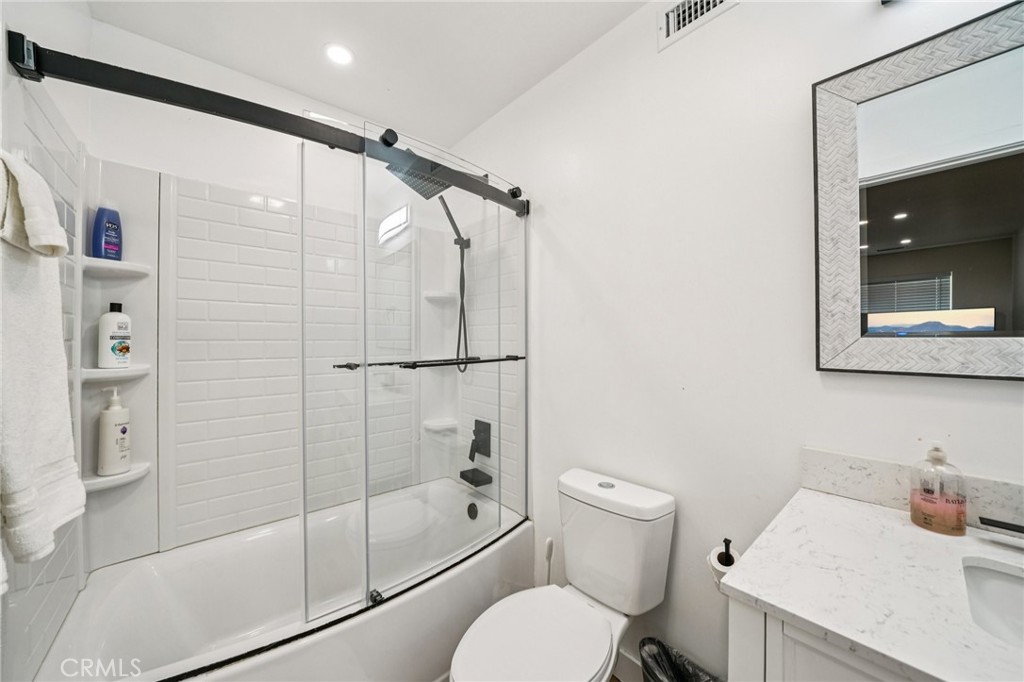 26845 Modoc Lane Lake Arrowhead, CA 92352 - Photo 43 of 56 a bathroom with a shower toilet and sink