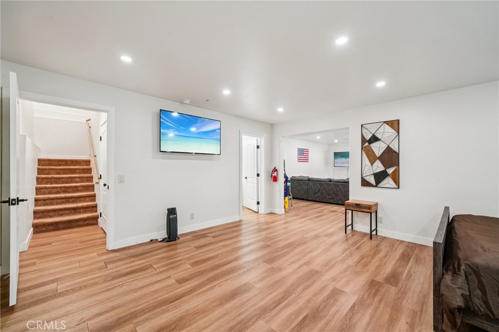 26845 Modoc Lane Lake Arrowhead, CA 92352 - Photo 44 of 56 a view of a hallway with wooden floor and furniture