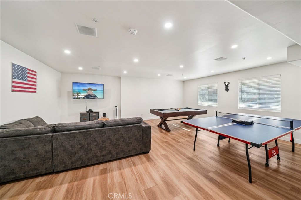 26845 Modoc Lane Lake Arrowhead, CA 92352 - Photo 46 of 56 a living room with furniture a wooden floor and potted plant