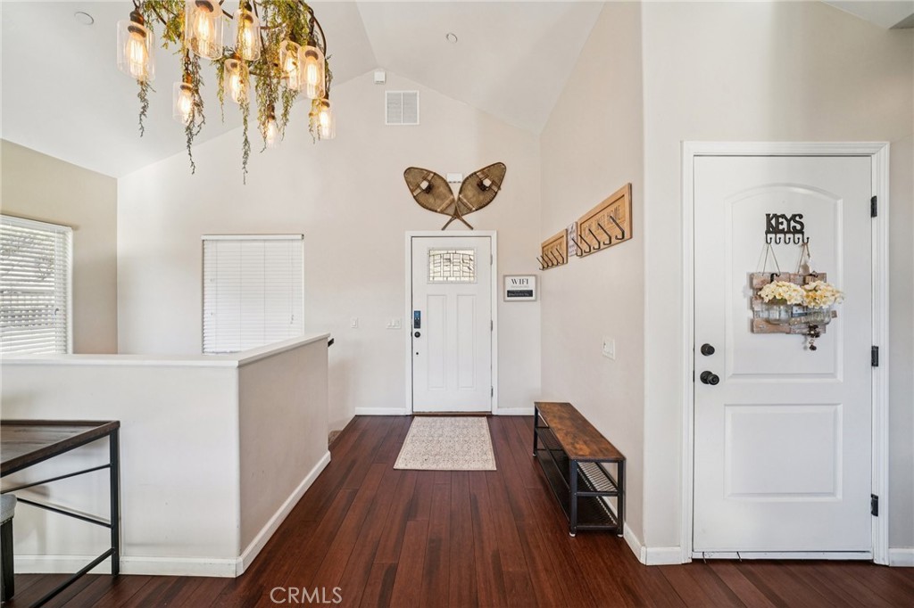 26845 Modoc Lane Lake Arrowhead, CA 92352 - Photo 5 of 56 a view of a hallway with wooden floor and staircase