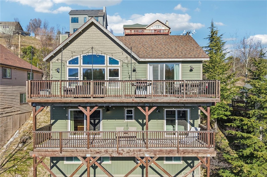 26845 Modoc Lane Lake Arrowhead, CA 92352 - Photo 52 of 56 Dramatic great-room windows and wraparound upper deck capture the scenery.