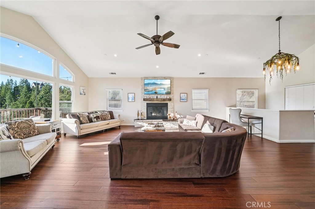 26845 Modoc Lane Lake Arrowhead, CA 92352 - Photo 9 of 56 a living room with fireplace furniture and a wooden floor