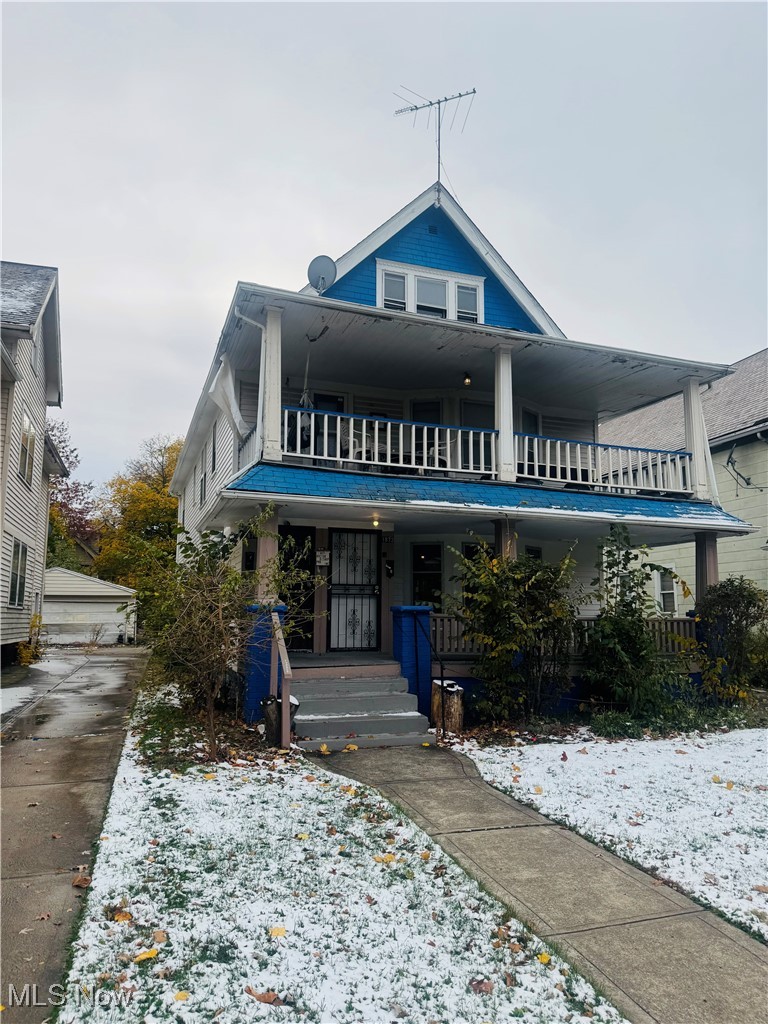 1872 Lampson Road Cleveland, OH 44112 - Photo 2 of 28 View of front facade with a balcony and a porch