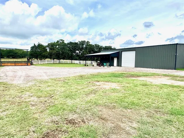 a view of an swimming pool with a yard