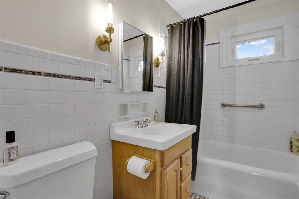 264 Sumner Avenue Springfield, MA 01108 - Photo 18 of 32 a bathroom with a sink a toilet and shower