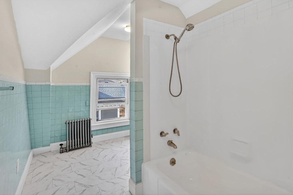 264 Sumner Avenue Springfield, MA 01108 - Photo 20 of 32 a bathroom with a bathtub and shower